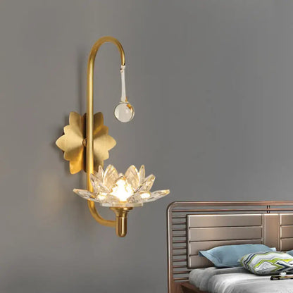 Gold crystal lotus sconce with curved gold arm and crystal lotus shade by Decorbites on Tampa Home & Garden Store