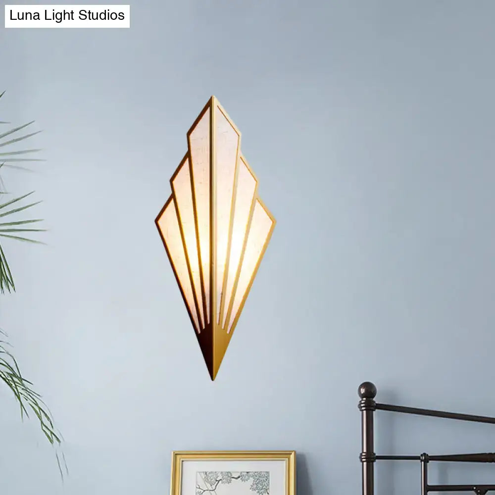 Gold Fan Wall Sconce by Decorbites with geometric fan silhouette on blue wall on Tampa Home & Garden Store