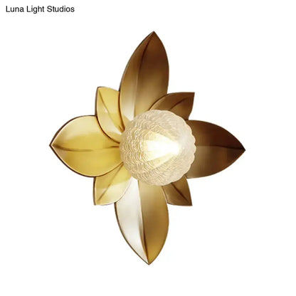 Modernist gold flower wall sconce with frosted glass center by Decorbites on Tampa Home & Garden Store