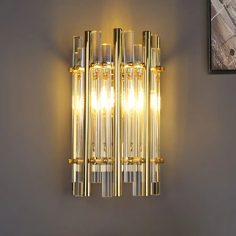 Gold tubular crystal wall sconce by Decorbites with glass tube columns and warm glow on Tampa Home & Garden Store