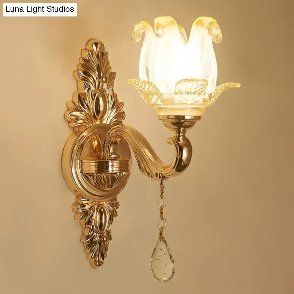 Gold glass shade wall sconce with flower-shaped shade, ornate backplate, crystal teardrop pendant on Tampa Home & Garden Store