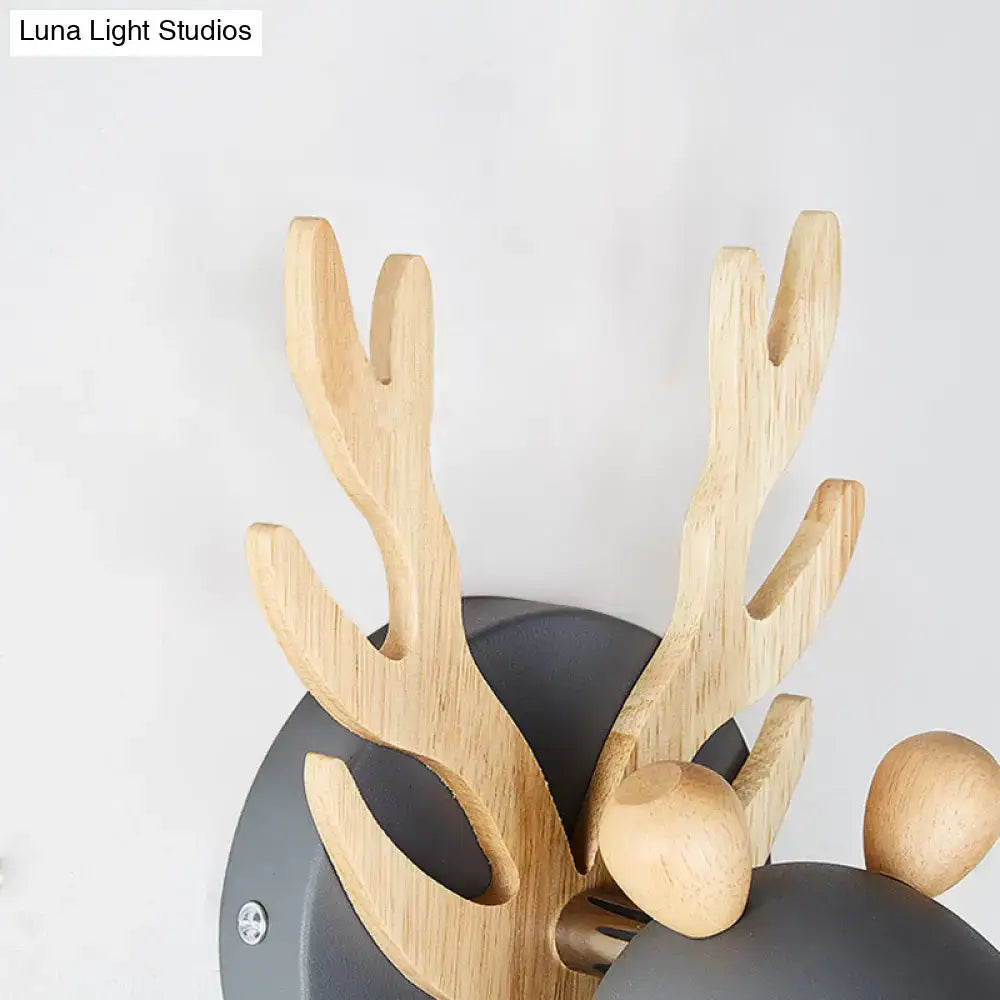 Green Wood Antler Sconce by Decorbites with natural wood antlers on a gray circular base on Tampa Home & Garden Store
