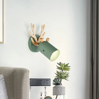 Green Wood Antler Sconce, wall-mounted green cylindrical shade with wooden antler arms on Tampa Home & Garden Store