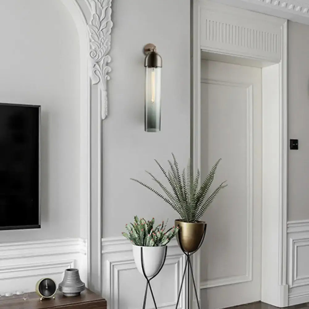 Decorbites Metallic Tube Sconce Light with glass tube and brass accents on wall on Tampa Home & Garden Store