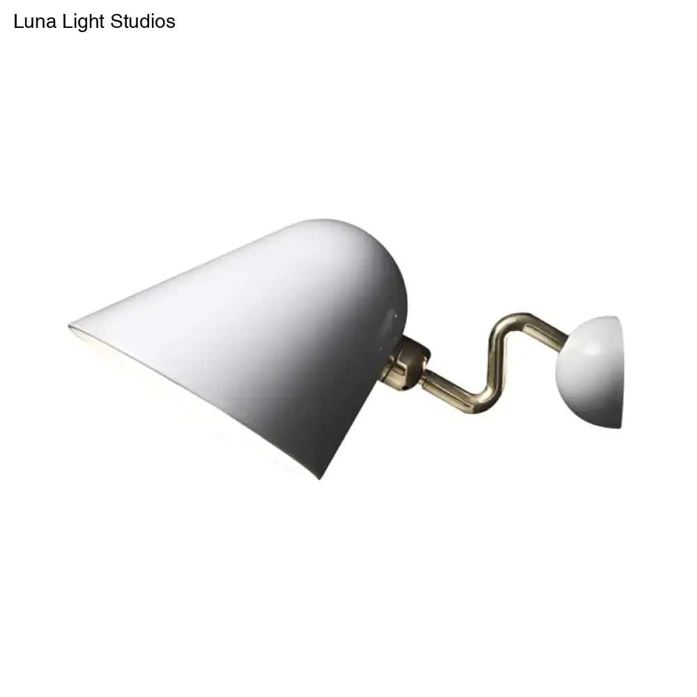 Gold wall sconce light Decorbites with white cone shade on curved brass arm on Tampa Home & Garden Store
