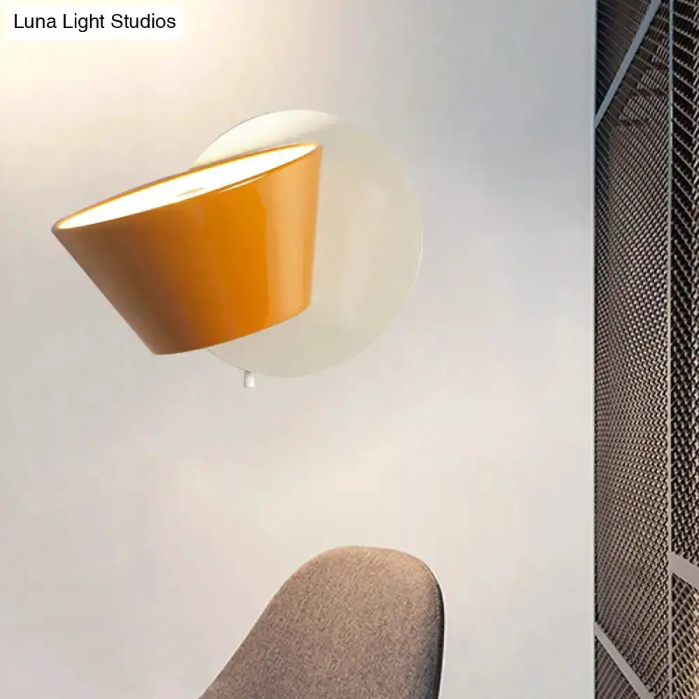 Wall lamp with a modernist orange metal shade and round white backplate by Decorbites on Tampa Home & Garden Store