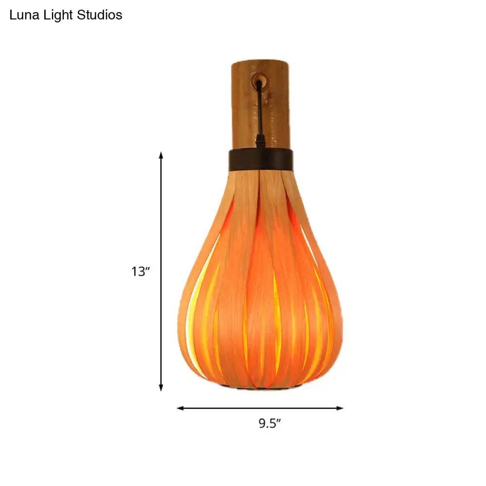 Bamboo Slat Wall Lantern pendant light with bamboo slats, warm orange glow Decorbites on Tampa Home & Garden Store