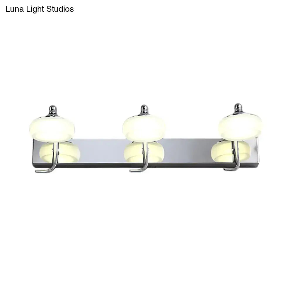 Silver frosted vanity light fixture with three bulbs on chrome bar by Decorbites on Tampa Home & Garden Store