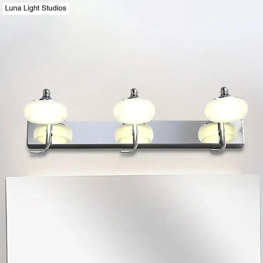 Silver Frosted Vanity Light three-light chrome bar with frosted glass globes above a mirror on Tampa Home & Garden Store