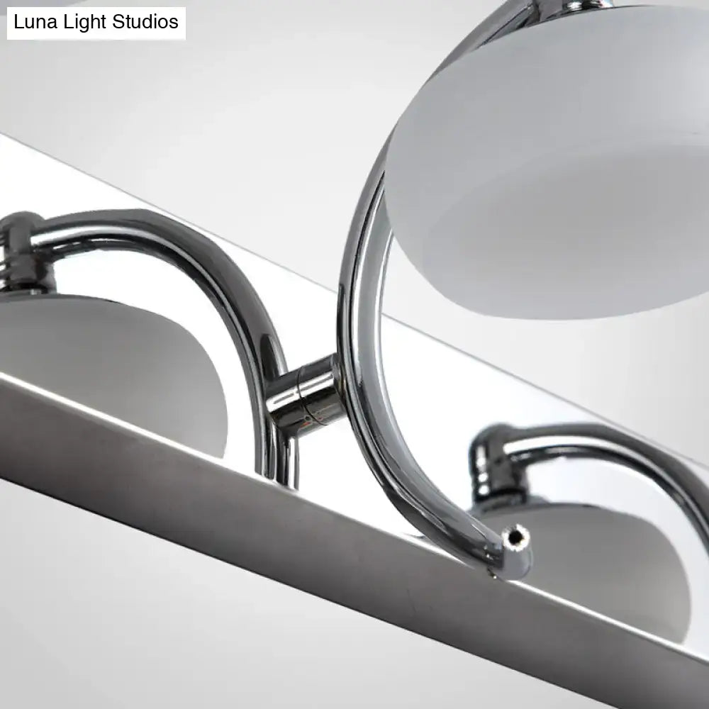 Silver frosted vanity light with chrome arms and two frosted glass shades on Tampa Home & Garden Store