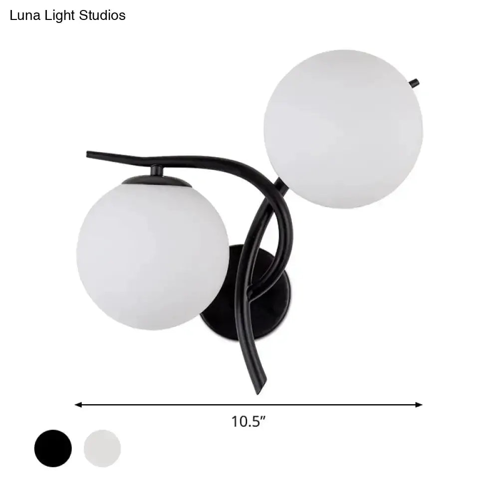 Decorbites modernist black metal wall sconce with milky glass globes, two-light bedroom fixture on Tampa Home & Garden Store