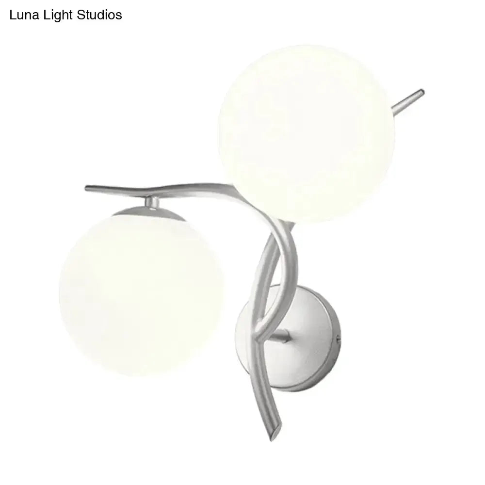 Modernist wall sconce with two milky glass globes in silver finish on Tampa Home & Garden Store