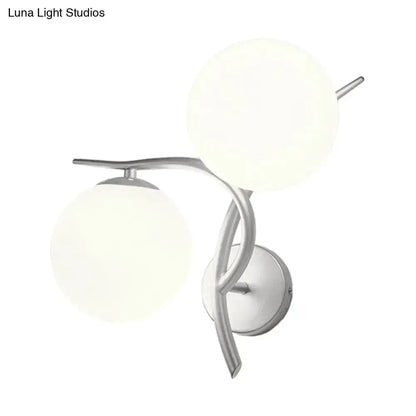 Modernist wall sconce with two milky glass globes in silver finish on Tampa Home & Garden Store