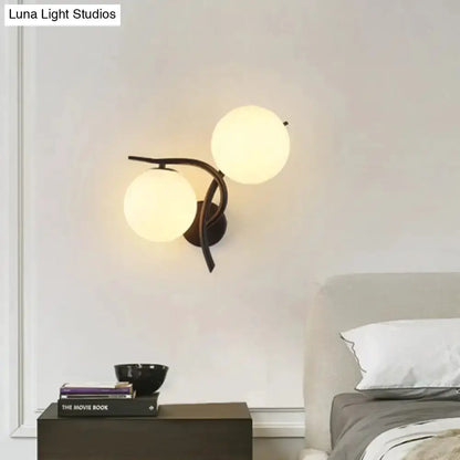 Decorbites modernist silver and black wall sconce with two milky glass globes for bedroom on Tampa Home & Garden Store