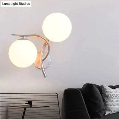 Modernist two-globe wall sconce in silver & black with milky glass by Decorbites on Tampa Home & Garden Store