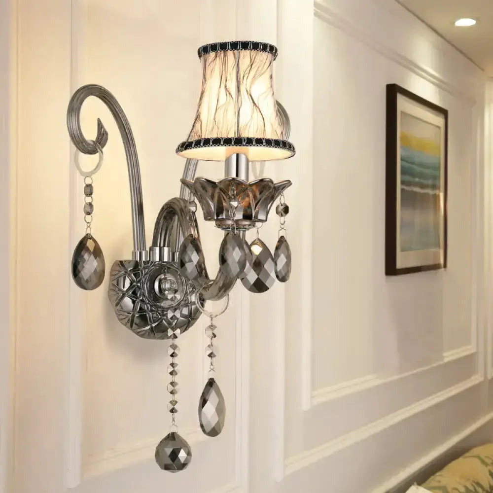 Modernist smoke grey crystal wall sconce with hanging prism drops on chrome mount on Tampa Home & Garden Store