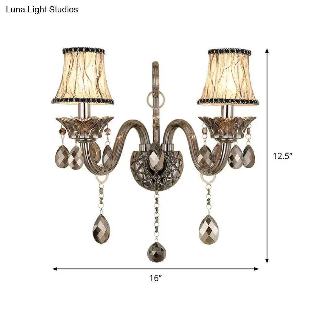 Decorbites modernist smoke grey crystal wall sconce with dual arms and hanging prisms on Tampa Home & Garden Store