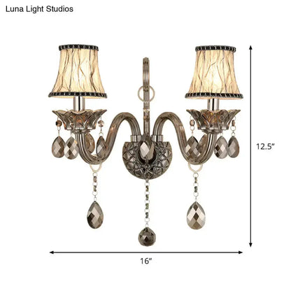 Decorbites modernist smoke grey crystal wall sconce with dual arms and hanging prisms on Tampa Home & Garden Store