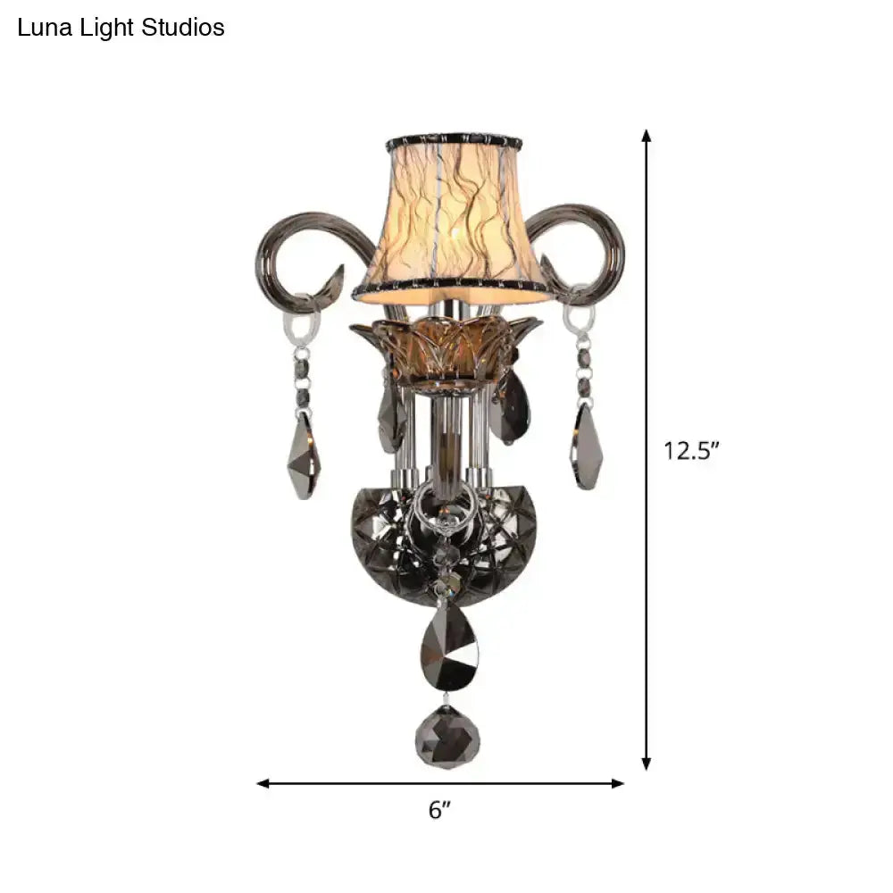 Modernist smoke-grey crystal wall sconce with hanging prisms and a fabric shade by Decorbites on Tampa Home & Garden Store