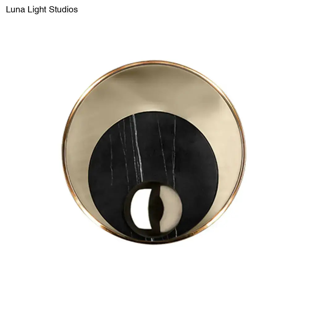 Round modernist LED wall sconce with gold rim and black marble center by Decorbites on Tampa Home & Garden Store