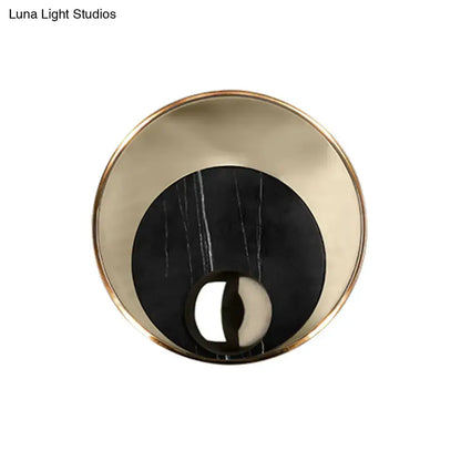 Round modernist LED wall sconce with gold rim and black marble center by Decorbites on Tampa Home & Garden Store