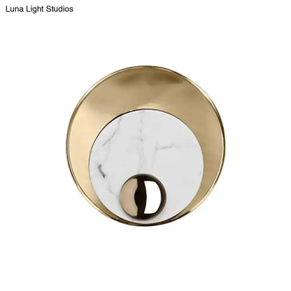 Modernist LED sconce with white marble inset and gold brass backplate for bedroom lighting on Tampa Home & Garden Store