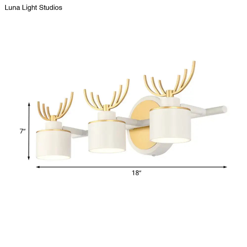 Decorbites White Gold Antler Sconce with three white shades and gold antler accents, wall mount on Tampa Home & Garden Store
