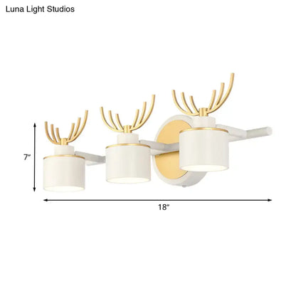 Decorbites White Gold Antler Sconce with three white shades and gold antler accents, wall mount on Tampa Home & Garden Store
