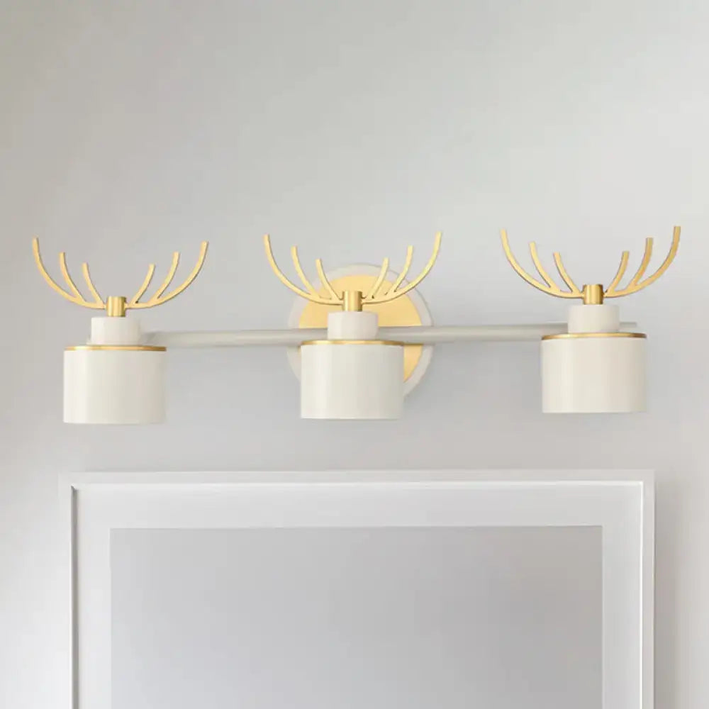 White Gold Antler Sconce trio with cylinder shades and gold antler accents by Decorbites on Tampa Home & Garden Store