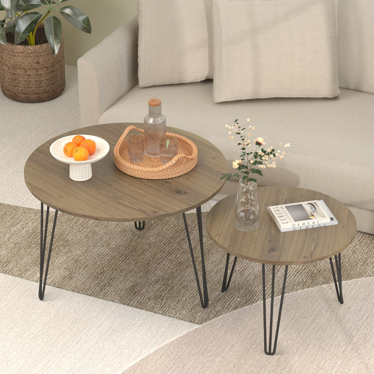 Rustic round nesting coffee tables with black metal frames and light brown wood tops on Tampa Home & Garden Store