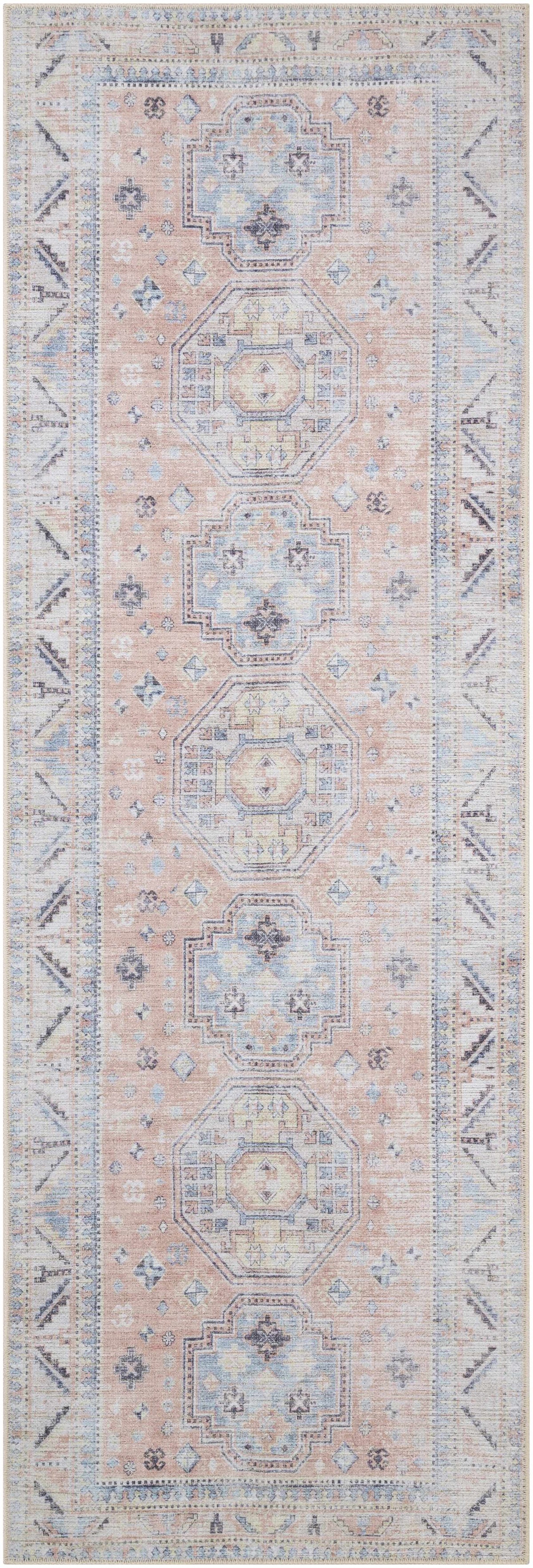 Morcott Peach Washable Area Rug by Boutique Rugs with pale blue medallion motifs in peach on Tampa Home & Garden Store