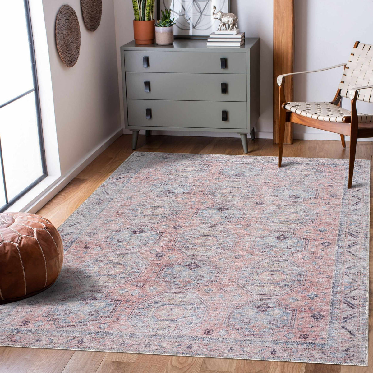 Morcott Peach Washable Area Rug in peach and blue-gray with a faded geometric motif on Tampa Home & Garden Store