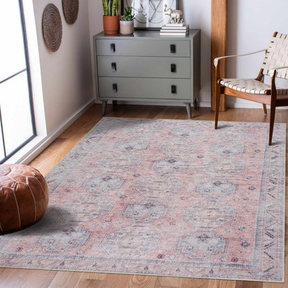 Morcott Peach Washable Area Rug in peach and blue-gray with a faded geometric motif on Tampa Home & Garden Store