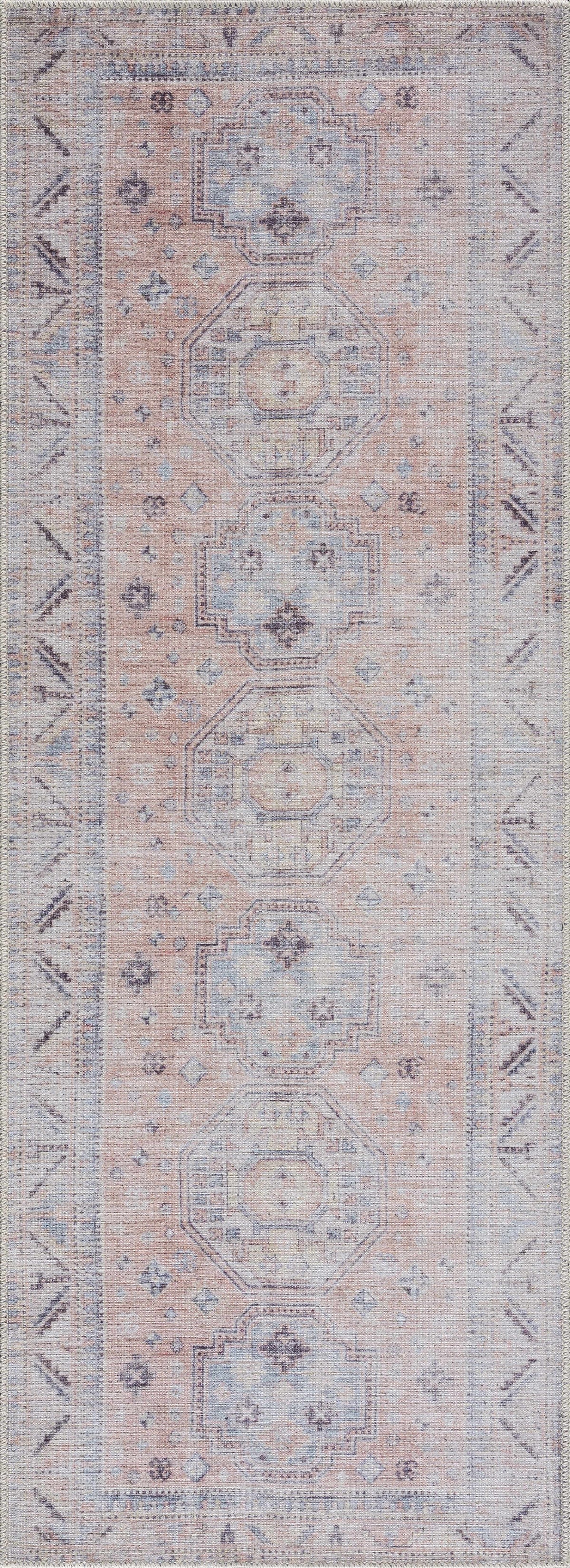 Morcott Peach Washable Area Rug by Boutique Rugs in peach and blue-gray medallion pattern on Tampa Home & Garden Store
