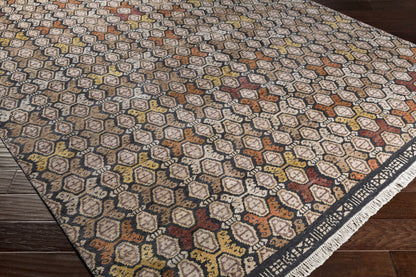 Mercersburg Carpet rug by Boutique Rugs with warm hexagon pattern on dark base and fringe on Tampa Home & Garden Store