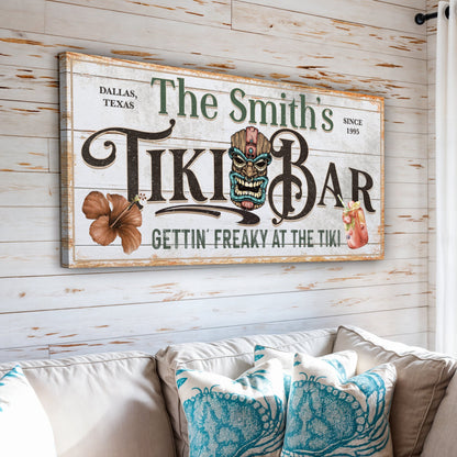 Personalized tiki bar sign canvas with distressed white surface and green lettering on Tampa Home & Garden Store