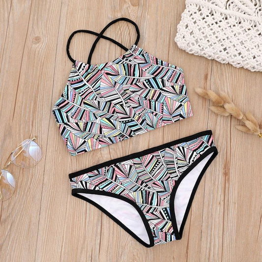 Girls multicolored geometric two-piece bikini swimsuit with halter top and black trim bottoms on Tampa Home & Garden Store