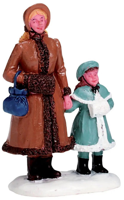 Day in Town Village figurine pair in winter coats brown woman with blue purse turquoise child on Tampa Home & Garden Store