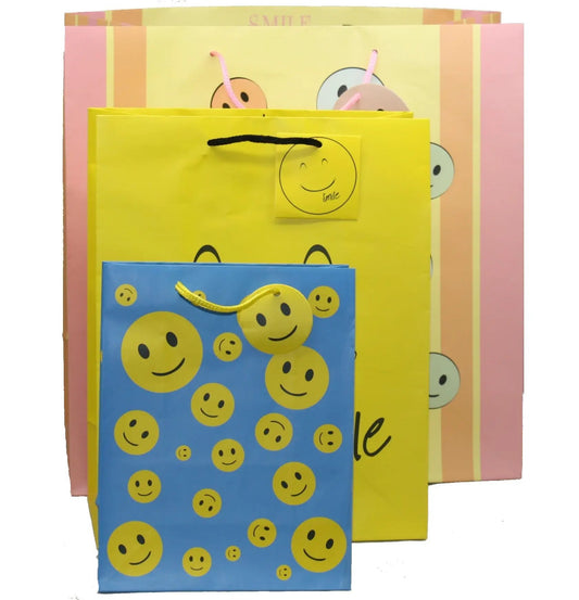 3-piece Smiley Face Gift Bag Set with yellow blue pink bags from The Country Christmas Loft on Tampa Home & Garden Store