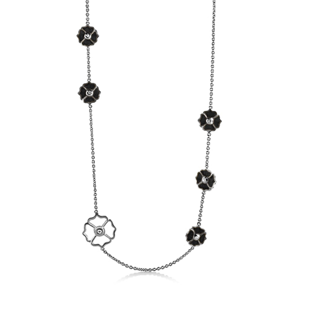 Poppy Love Long Necklace with black flower charms on a silver chain and a white floral pendant on Tampa Home & Garden Store