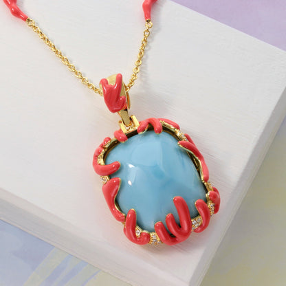 Pendant necklace with sky-blue stone in coral-pink claw setting on gold chain by Lauren G Adams on Tampa Home & Garden Store