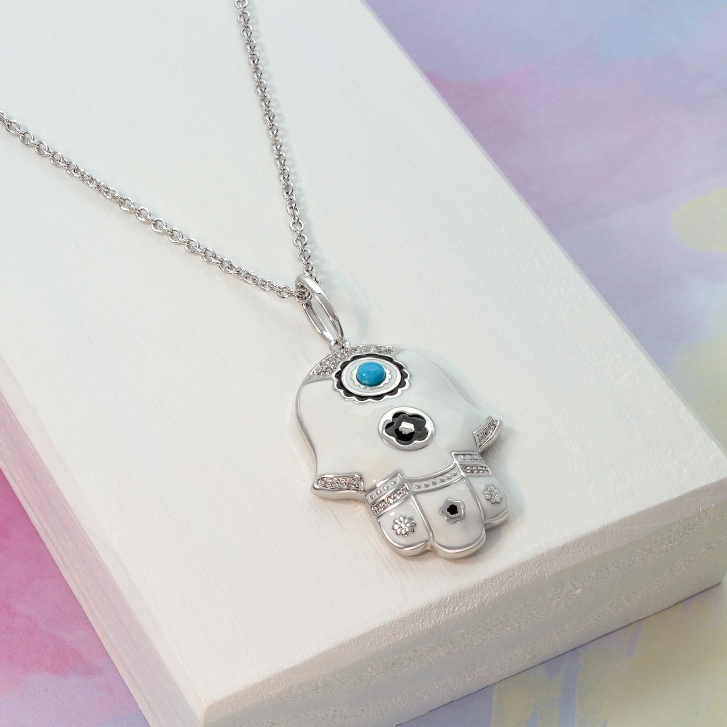 Lucky Hamsa Necklace pendant in silver-tone with white enamel hand and turquoise center on Tampa Home & Garden Store