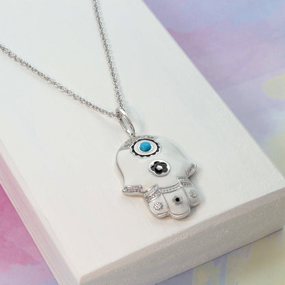Lucky Hamsa Necklace pendant in silver-tone with white enamel hand and turquoise center on Tampa Home & Garden Store