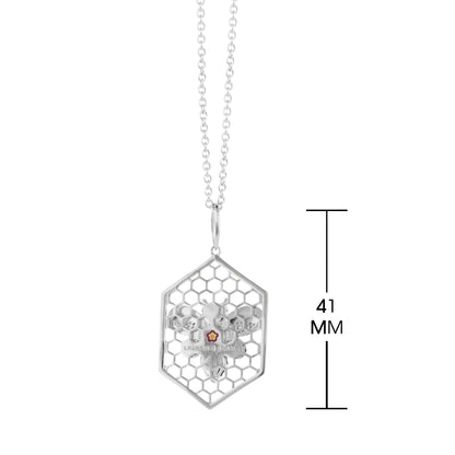Beehive necklace by Lauren G Adams with a hexagonal honeycomb cage on a silver chain on Tampa Home & Garden Store