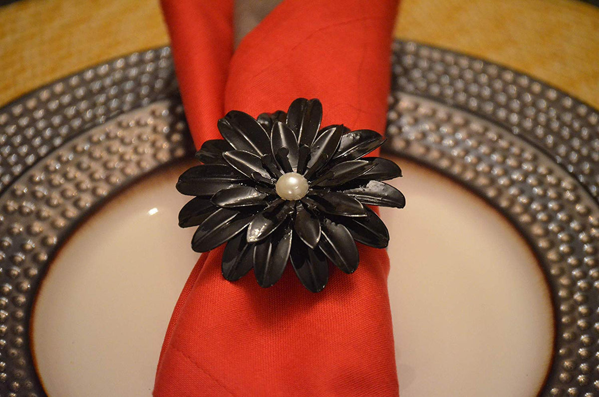 Vibhsa black floral napkin ring set with pearl center on red napkin dining decor on Tampa Home & Garden Store