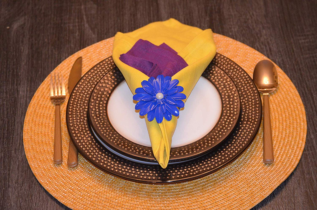 Vibhsa blue floral napkin rings set of 4 with pearl centers around yellow napkin on charger on Tampa Home & Garden Store