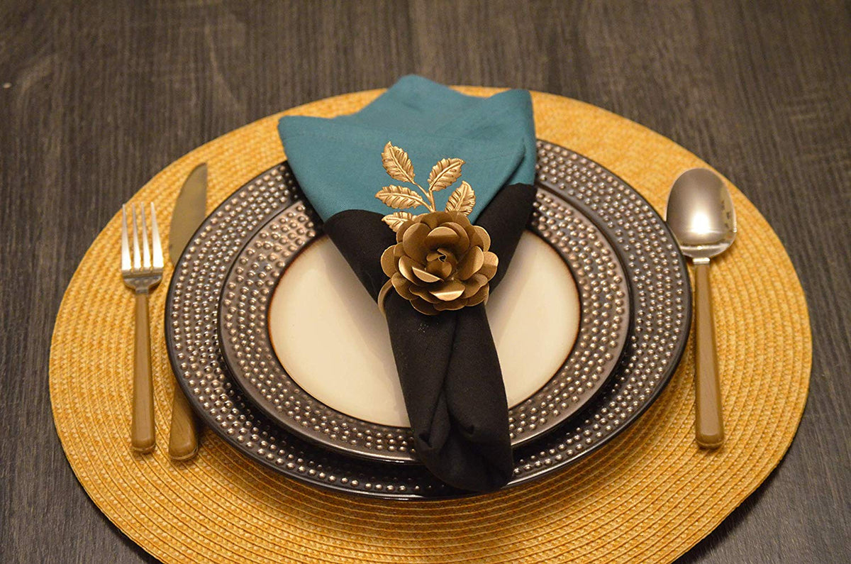 Vibhsa Gold Rose Napkin Rings set of 4 handcrafted around a black napkin on a charger plate on Tampa Home & Garden Store