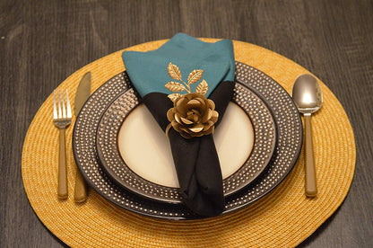 Vibhsa Gold Rose Napkin Rings set of 4 handcrafted around a black napkin on a charger plate on Tampa Home & Garden Store