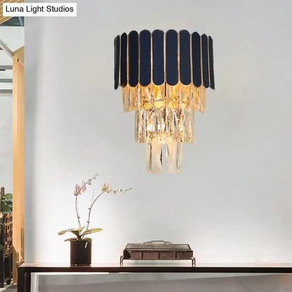 Crystal modern wall sconce with navy scalloped shade, gold trim, and hanging crystal prisms on Tampa Home & Garden Store