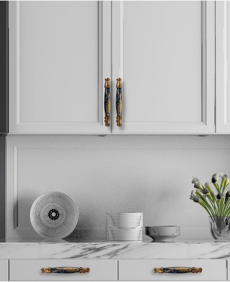 Stevvex navy blue ceramic door handles with gold accents for cabinet doors and drawer pulls on Tampa Home & Garden Store